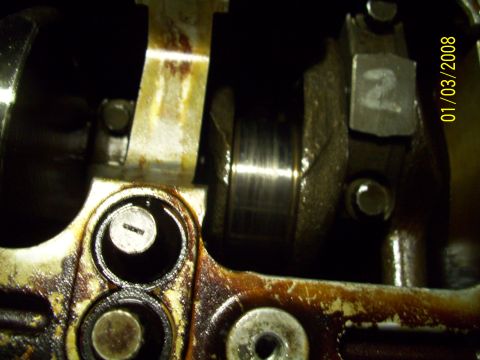 1995 Ford Probe - Internal engine components, including a crankshaft and connecting rod, are shown in this close-up view.