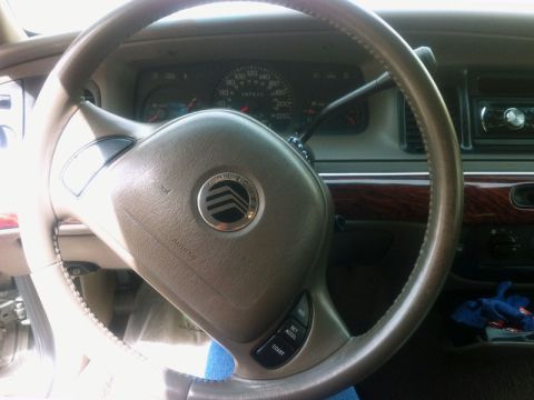 2001 Mercury Grand Marquis - Interior view of a 2001 Mercury Grand Marquis, showing the steering wheel and instrument cluster.