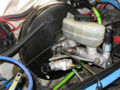 1995 Ford Bronco - Close-up of brake master cylinder and booster assembly, showing the fluid reservoir and proportioning valve.