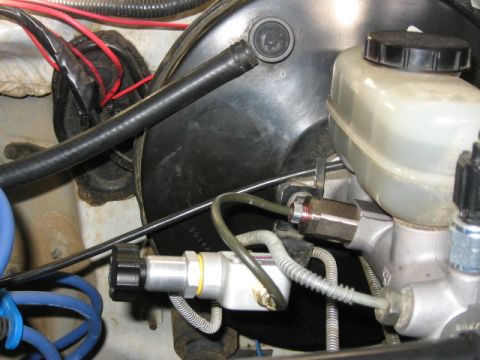 1995 Ford Bronco - Close-up view of the brake system components, including the master cylinder and proportioning valve.
