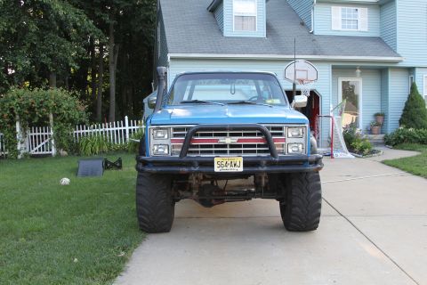 1978 Chevrolet C/K Pickup - This modified pickup truck features a snorkel and heavy-duty bumper, suggesting off-road use.
