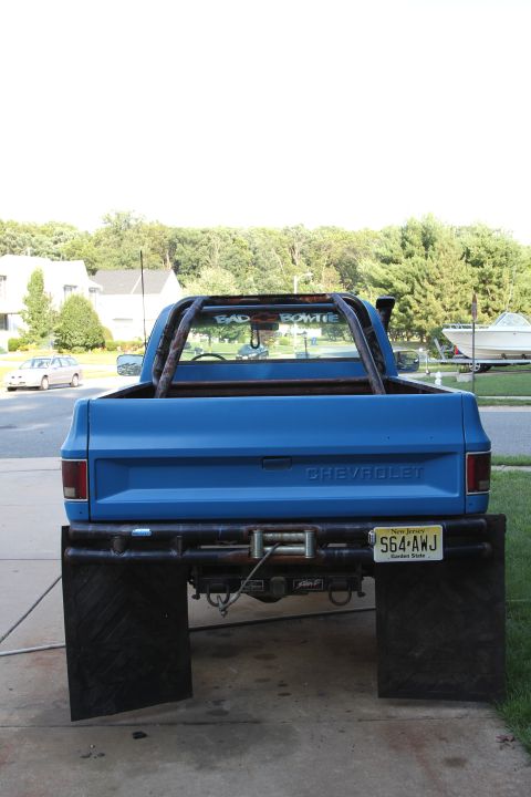 1978 Chevrolet C/K Pickup - Rear view of a blue 1978 Chevrolet C/K Pickup truck with custom modifications.
