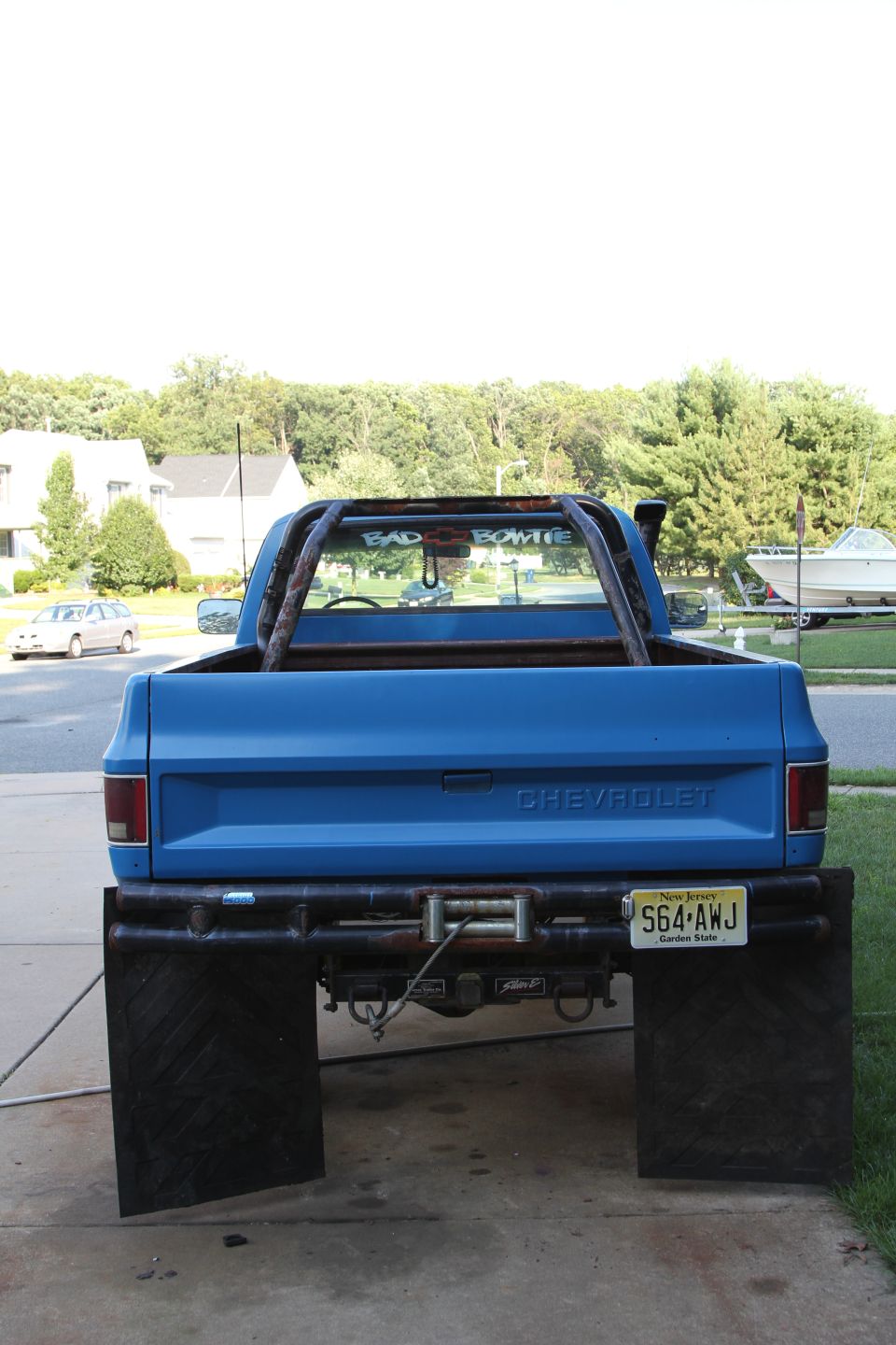 1978 Chevrolet C/K Pickup rear with large mud flaps and roll bar
