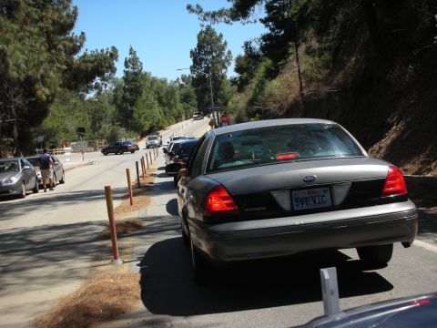 2004 Ford Crown Victoria - Rear view of a Ford Crown Victoria in a line of traffic on a sunny day.
