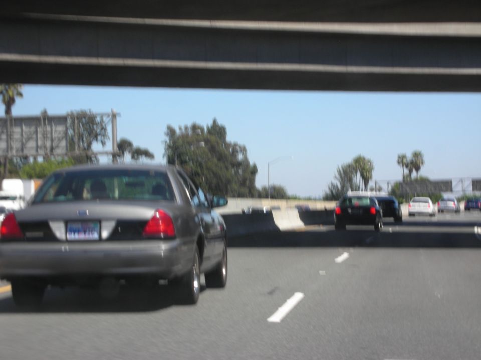 Rear view of a 2004 Ford Crown Victoria on highway
