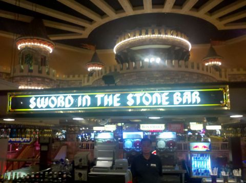 1996 Ford Bronco - The Sword in the Stone Bar interior features a bartender and various drink dispensers.