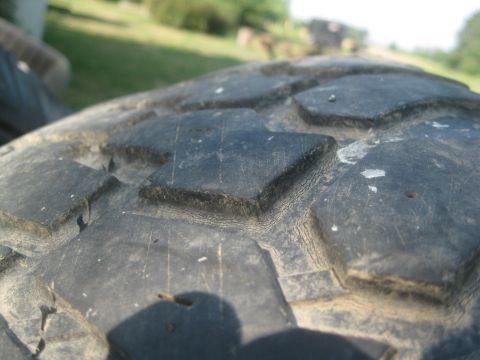 1995 Ford Ranger - A close-up view of the aggressive tread pattern on a tire.