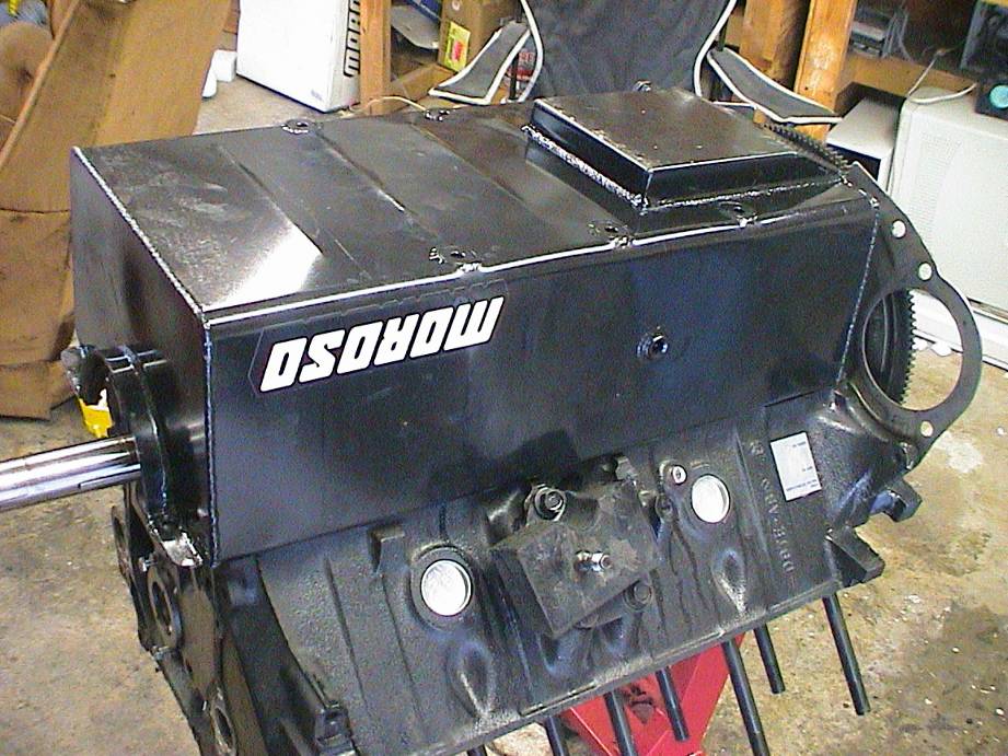 New pan only has only 4 bolts holding it on starter touchs that weld and less room to tighten torque converter bolts It better improve my time!