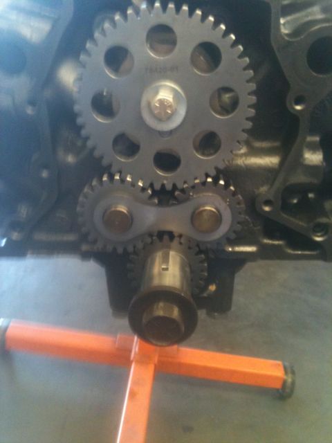 1993 Ford Bronco - Close-up view of engine timing gears, with part number '18A20-61' visible on the larger gear.