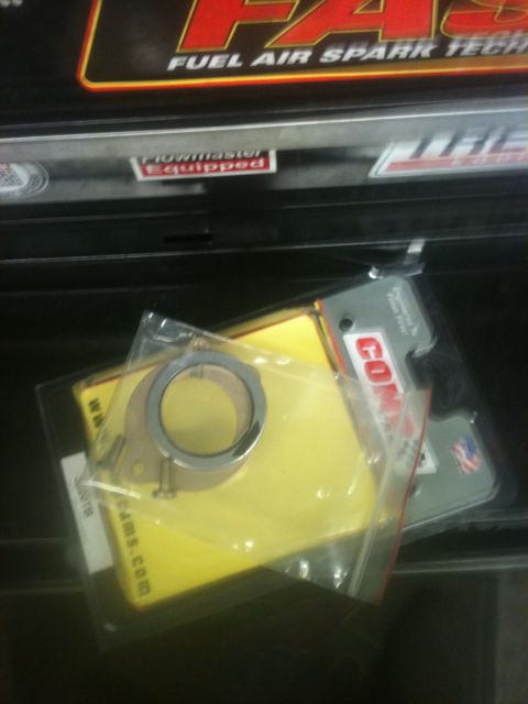 1993 Ford Bronco - A close-up of an engine gasket and ring, packaged for sale, with brand names visible.
