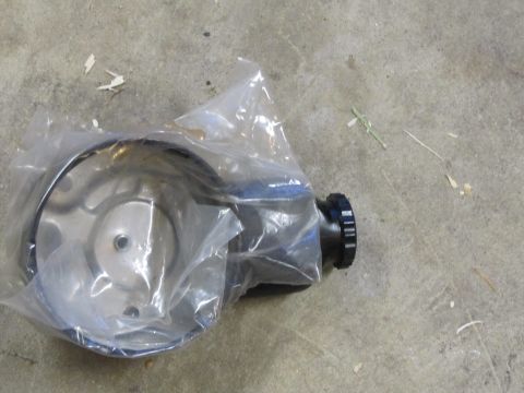 1995 Ford Bronco - A new power steering pump is shown packaged on a concrete surface.