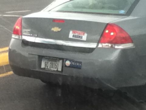 2006 Ford E350 - This car displays political bumper stickers on its rear.