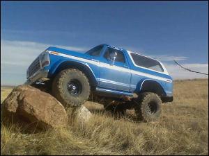 1996 Ford Bronco - This classic Ford Bronco is navigating a rocky trail, its off-road capabilities.