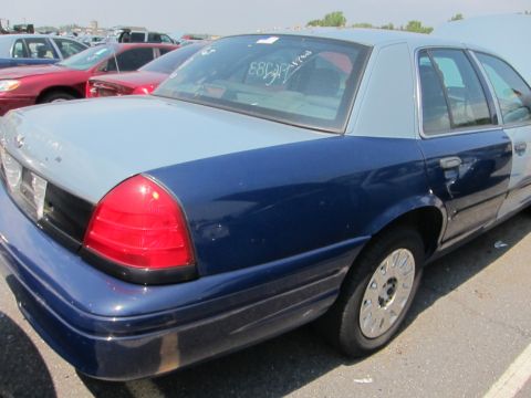 1991 Ford LTD Crown Victoria - This Ford Crown Victoria has a two-tone paint scheme and appears to be from the late 1990s.