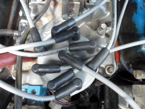 1989 Ford Bronco - This image shows a close-up view of an engine's distributor cap and spark plug wires.