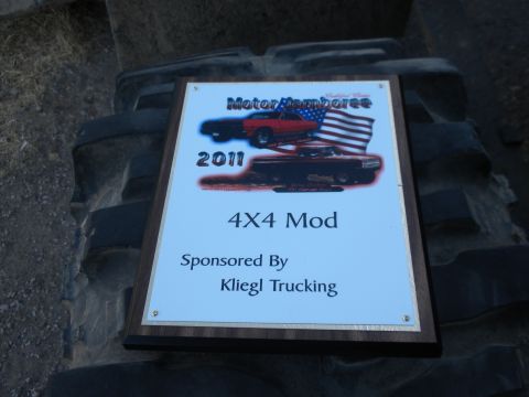 1989 Ford Bronco - A plaque commemorating a 4x4 mod event in 2011 is displayed on a large tire.