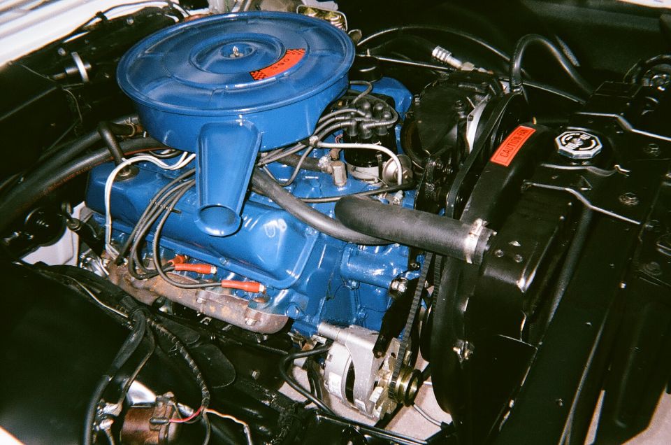 Ford V8 engine with blue painted valve covers and air cleaner assembly