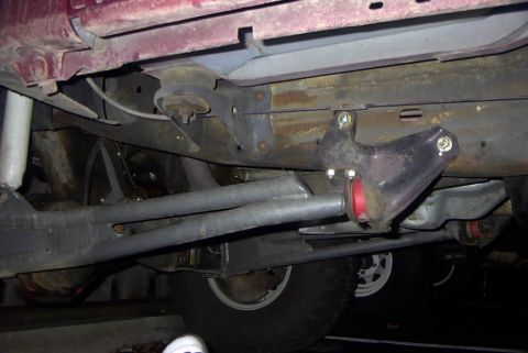 1994 Ford Bronco - Close-up of the undercarriage, focusing on suspension parts and frame.