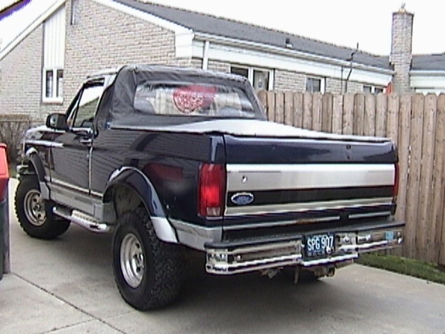 1995 Ford Bronco rear view with soft top and license plate SPG 907