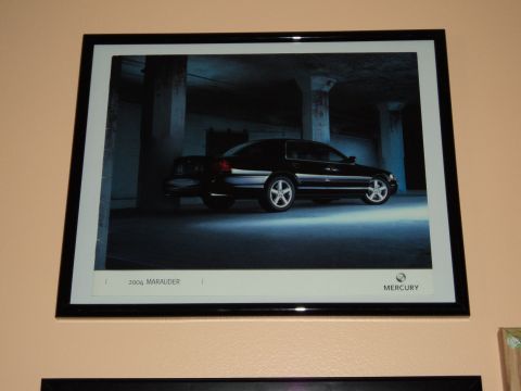 2004 Mercury Grand Marquis - A framed photograph of a 2004 Mercury Marauder is displayed on a wall.