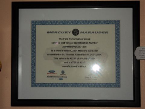 2004 Mercury Grand Marquis - This framed document details a limited-edition 2004 Mercury Marauder, including its VIN and build numbers.