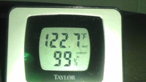 1989 Ford Bronco - This Taylor digital thermometer and hygrometer displays outdoor temperature and indoor humidity.