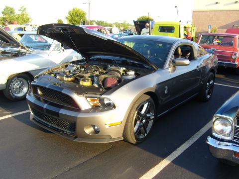 2007 Ford Mustang - A 2007 Ford Mustang is displayed with its hood open at a car meet.