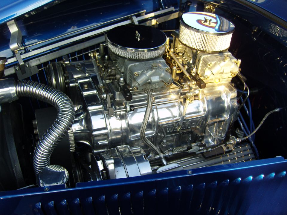 Close-up of a polished V8 engine with dual carburetors and a Weiand supercharger