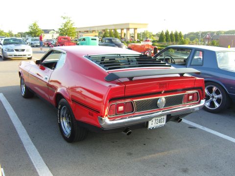 2007 Ford Mustang - Rear view of a red 1971 Ford Mustang Mach 1 with louvers and a spoiler.