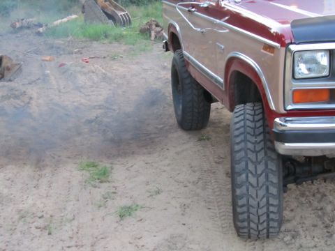 1984 Ford Bronco - This pickup truck, likely from the early 1980s, is shown from the front quarter with large off-road tires and black hood trim.
