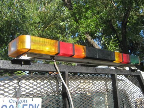 1972 Ford F-250 - A light bar with multiple colored lenses is mounted on the rack of a vehicle.