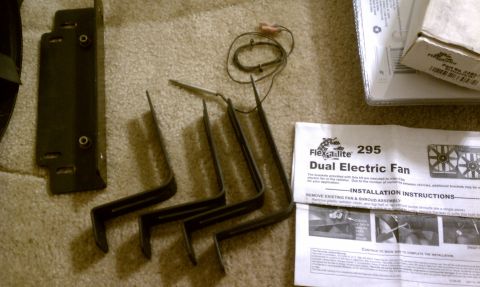 1990 Ford Bronco - This image shows a Flex-a-lite Dual Electric Fan kit, including installation instructions and mounting hardware.