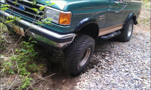 1990 Ford Bronco - This 1990 Ford Bronco is navigating a rough, off-road trail.