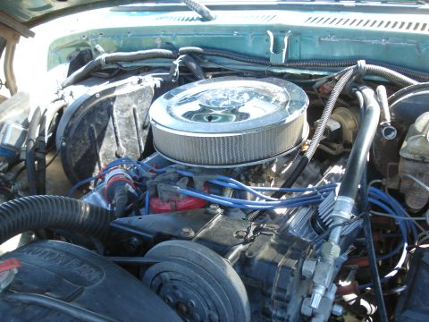 1979 Ford Bronco - Close-up view of a vehicle's engine compartment, showing various components and wiring.