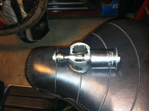 1981 Garelli Rally Sport - A chrome clamp is attached to the side of a black motorcycle seat.