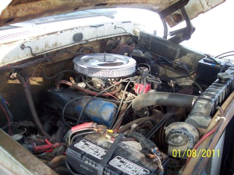 1973 Ford F-250 - Engine bay of a 1973 Ford F-250, showing the V8 engine and related components.