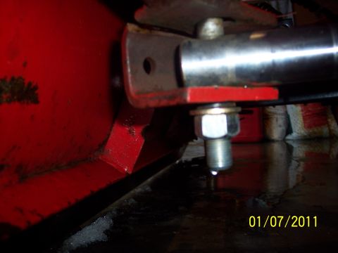 1973 Ford F-250 - Detail of a red plow attachment, showing metal components and a bolt, with a date stamp of 01/07/2011.