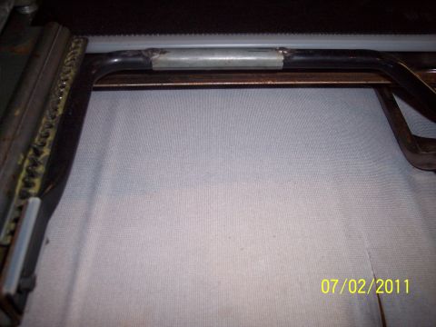 1973 Ford F-250 - Close-up of a vehicle seat frame, showing metal components and fabric. A date stamp is visible in the lower right corner.
