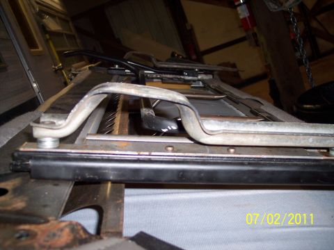 1973 Ford F-250 - Close-up view of vehicle seat rails and adjustment mechanism, dated 07/02/2011.