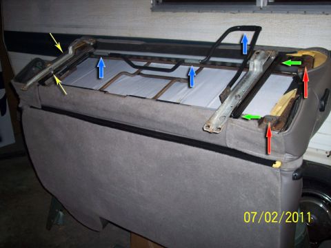 1973 Ford F-250 - Close-up of a vehicle seat's internal frame structure, showing mounting points and springs.