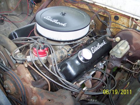 1973 Ford F-250 - Close-up view of a vehicle's engine bay, showing various components and aftermarket parts.