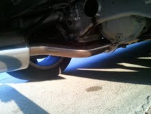 1996 Ford Bronco - Underside view of a vehicle's exhaust system and rear differential.