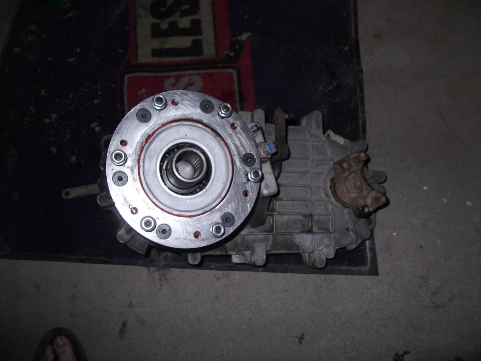 Transfer case part with bearing and bolts