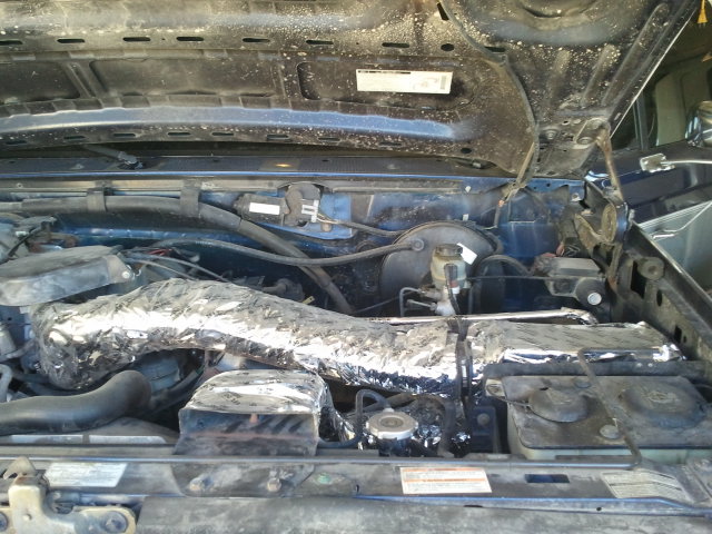 1995 Ford Bronco engine bay, showing intake manifold wrapped in aluminum foil