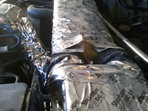 1995 Ford Bronco - You can see the insulation between the pipes. Tape wouldnt hold it to the outside and around the box.