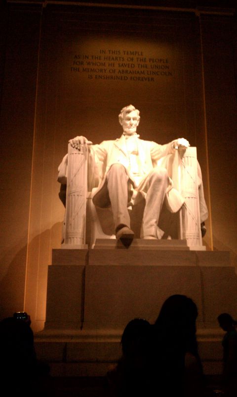 1990 Ford Bronco - Night interior view of the Lincoln Memorial statue lit from above, with the inscription "IN THIS TEMPLE... IS ENSHRINED FOREVER" on the wal…