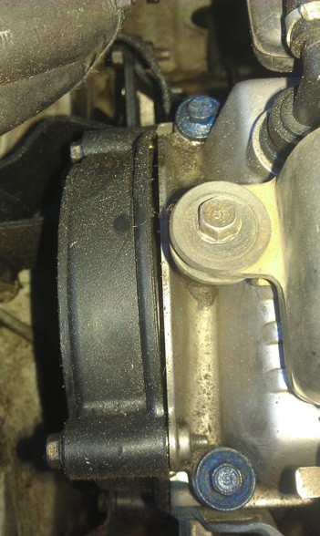 1991 Ford Festiva - Close-up view of an engine part, showing mechanical details and fasteners.