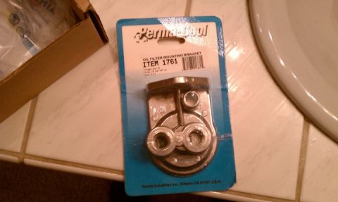 1990 Ford Bronco - A Perma-Cool oil filter mounting bracket is shown in its packaging.
