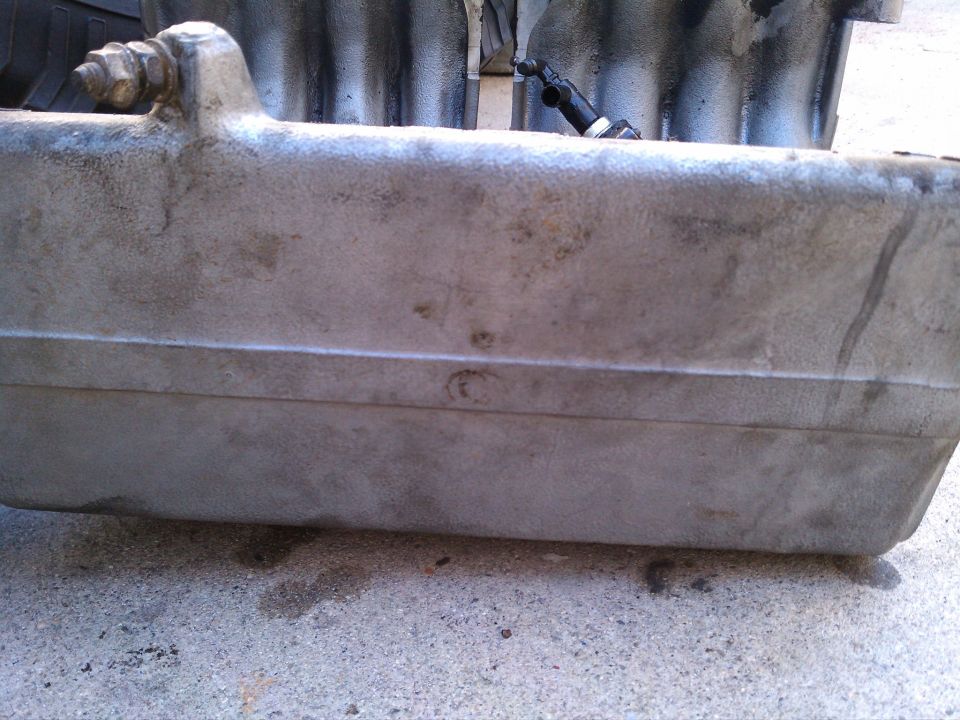 Engine intake manifold with bolt and hose connection