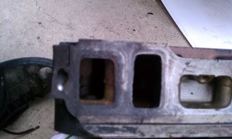 1990 Ford Bronco - Close-up view of an engine intake manifold, showing its internal structure and ports.